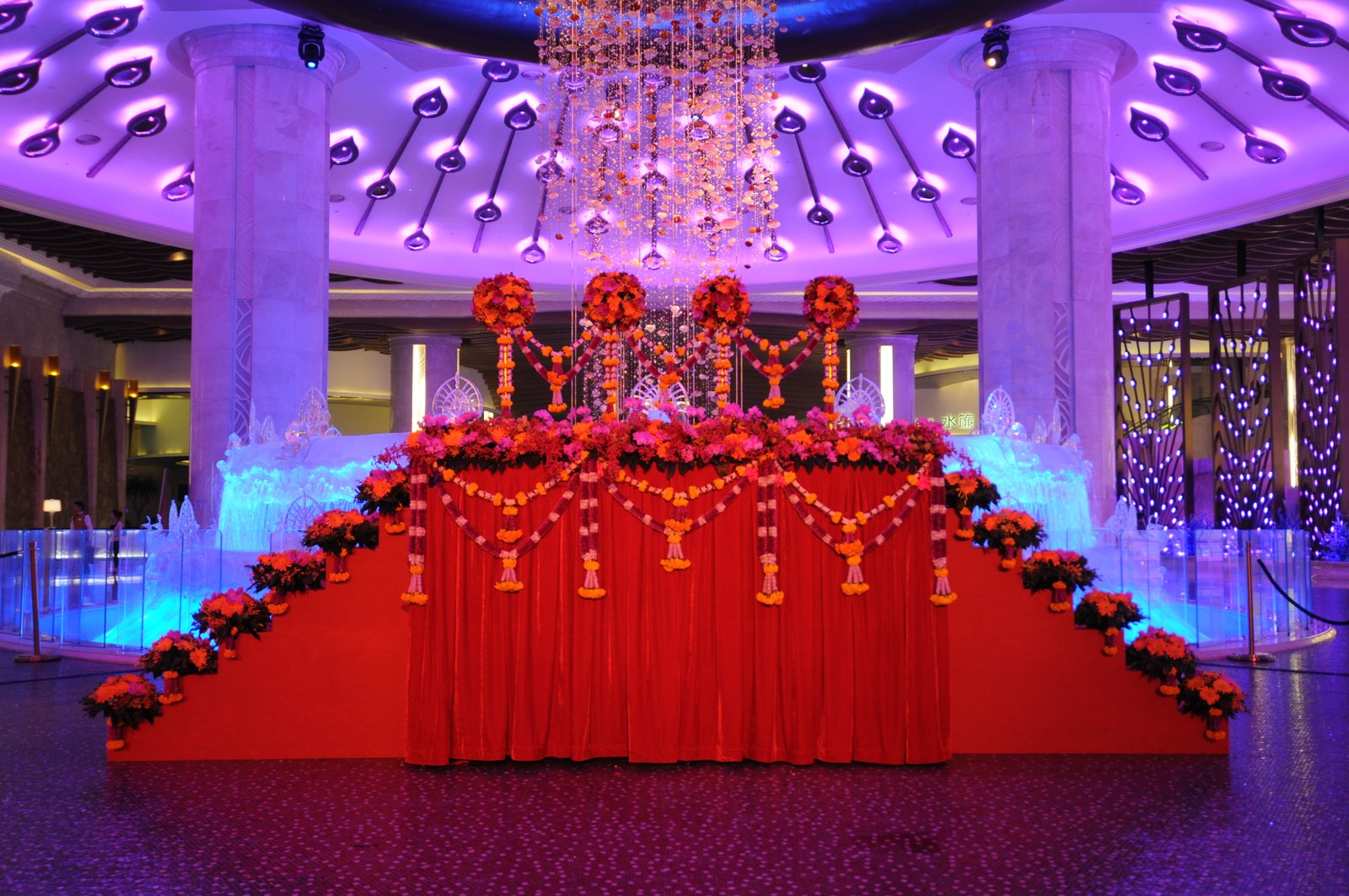 Festival Celebrations with people dancing on stage and colorful lighting